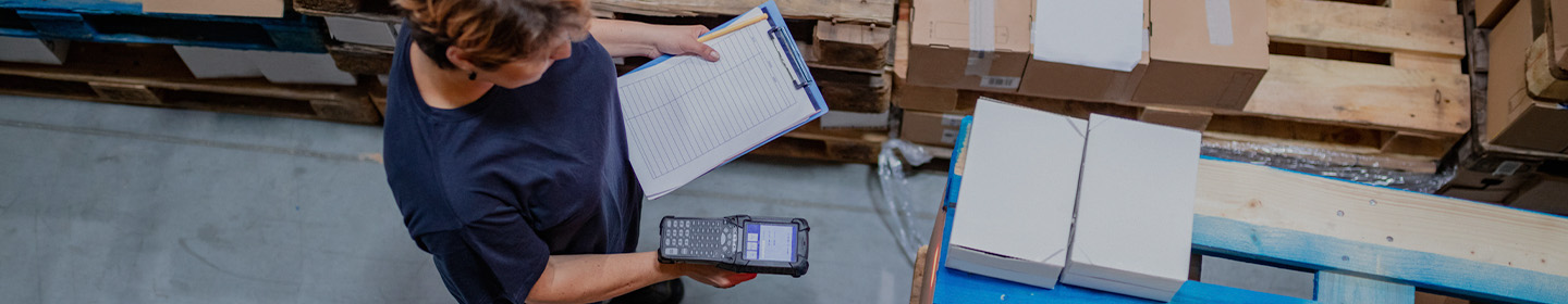 person using tablet in shipping yard