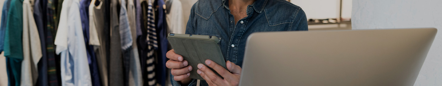 person using tablet in shipping yard